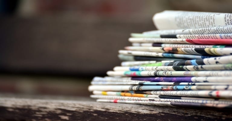 stacks of folded newspapers