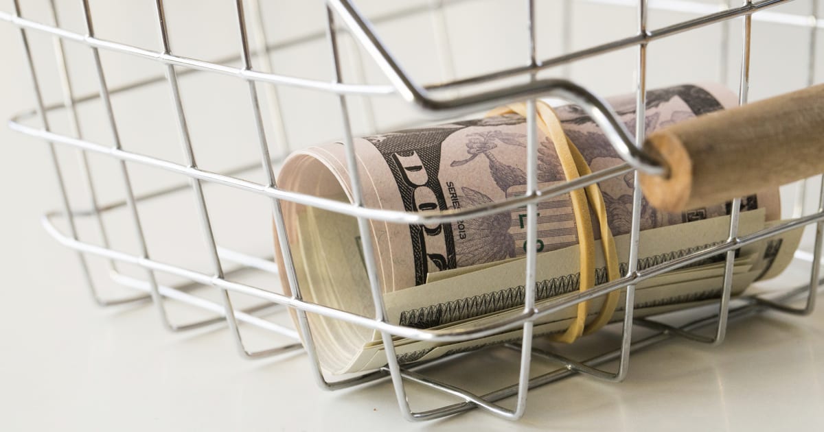Rolled dollar bills in wire basket